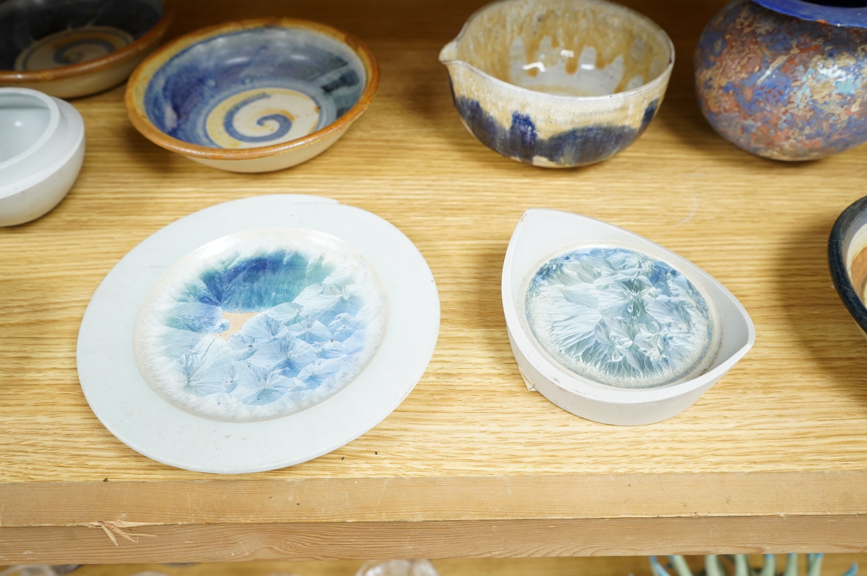 A collection of studio pottery to include crystalline glazed works by Stephen R Jones Des, Brighton, vases and a pair of dishes, largest 22cm high